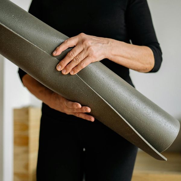 Person holding a challenging yoga balance pose, showing strength.